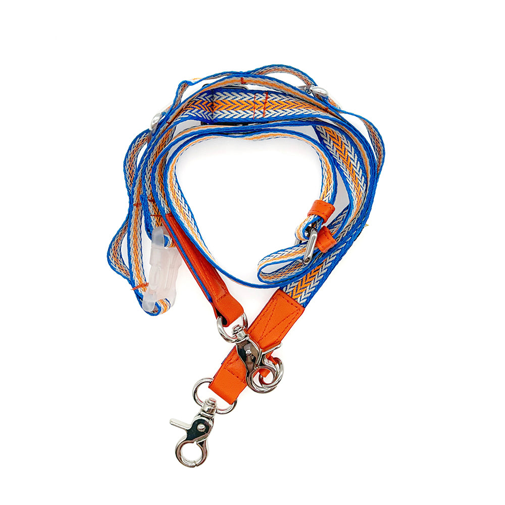 Orange and blue woven crossbody strap with metal hooks.